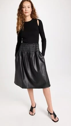 Proenza Schouler White Label Faux Leather Smocked Skirt -Denim Diva Shop pswll302831cd2d 1659710747703 2 0. UX357 QL90